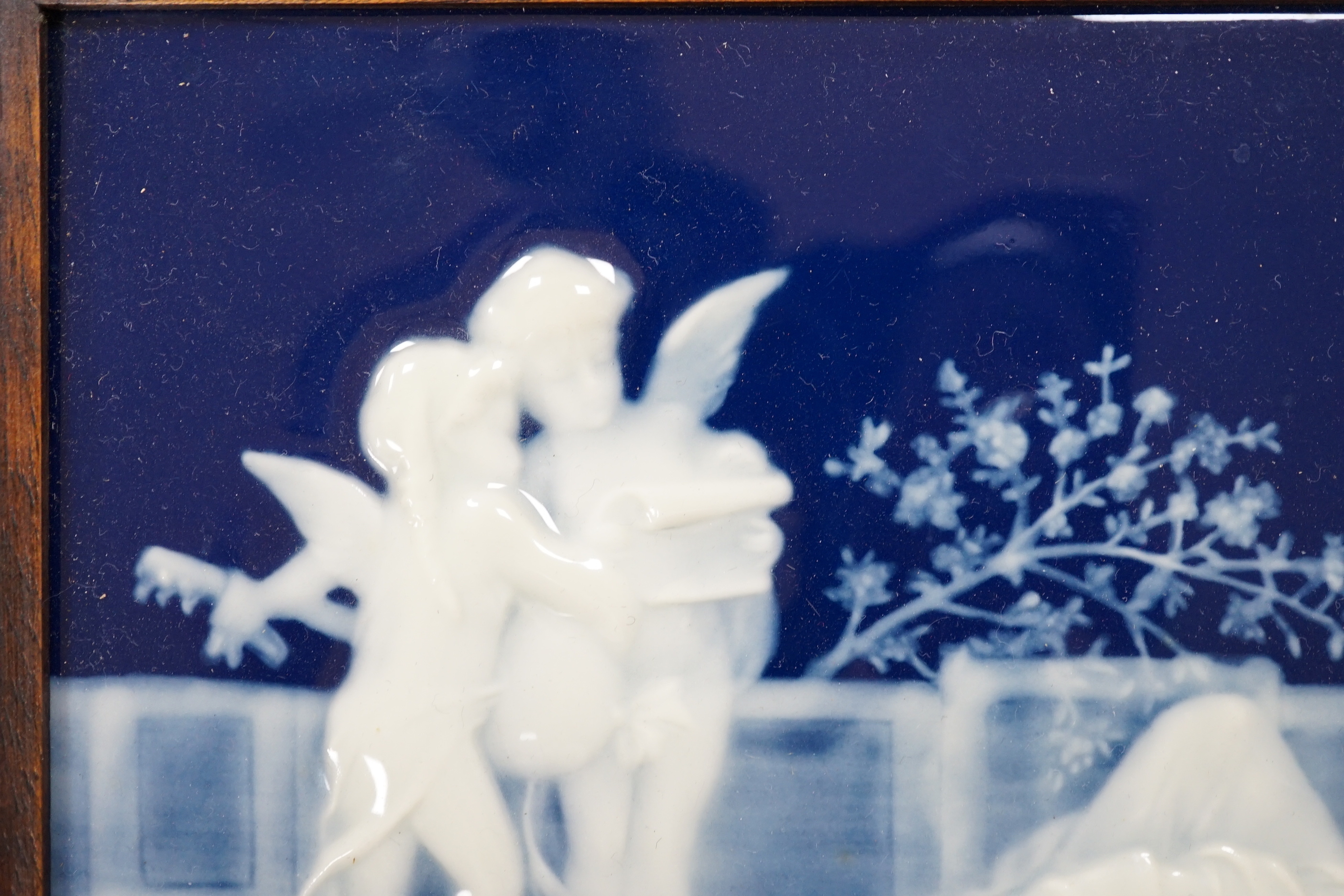 A framed pate sur pate panel, signed Chaufriase, recumbent female, Limoges, 20.5cm x 15cm